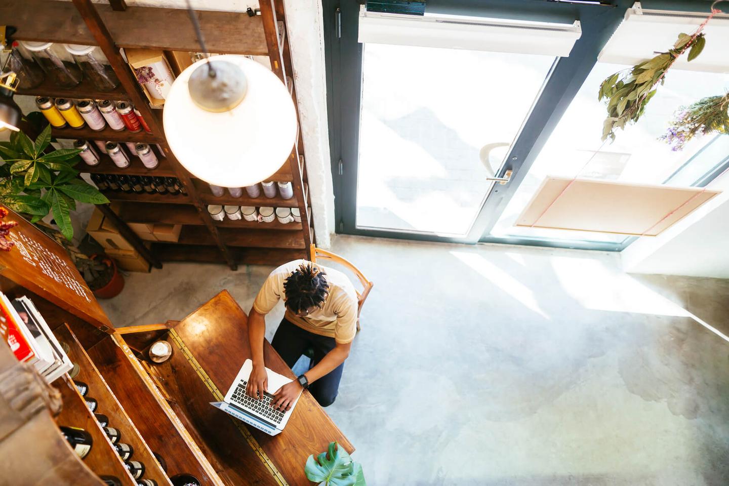 Woman arranging plants, not worrying about her businesses website security