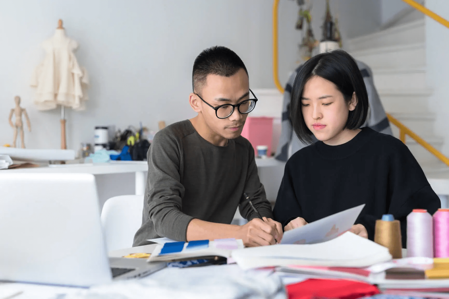 two people looking at laptop