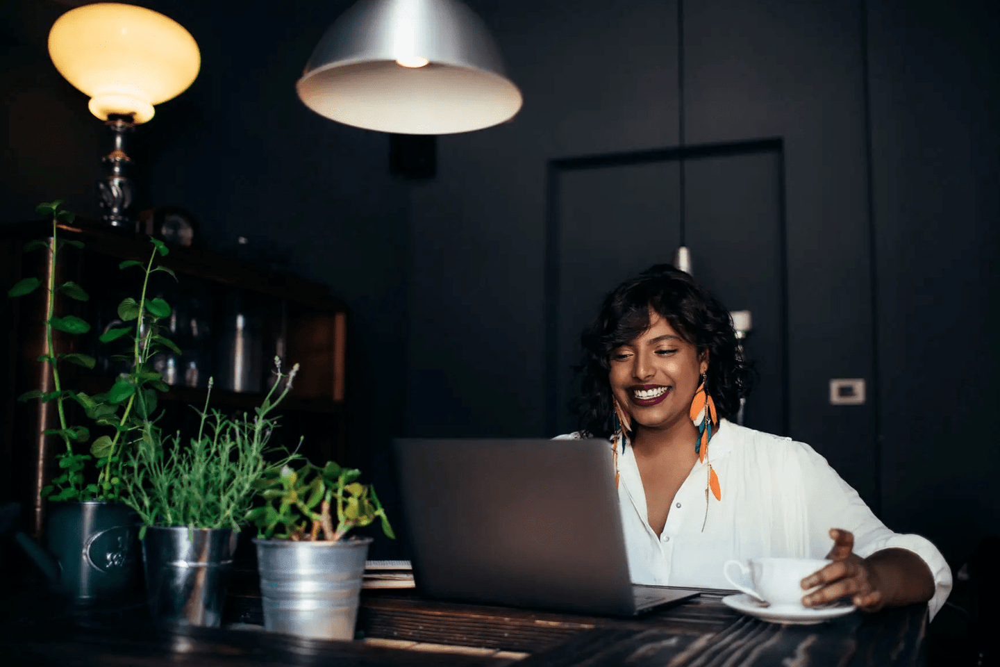 woman smiling at laptop