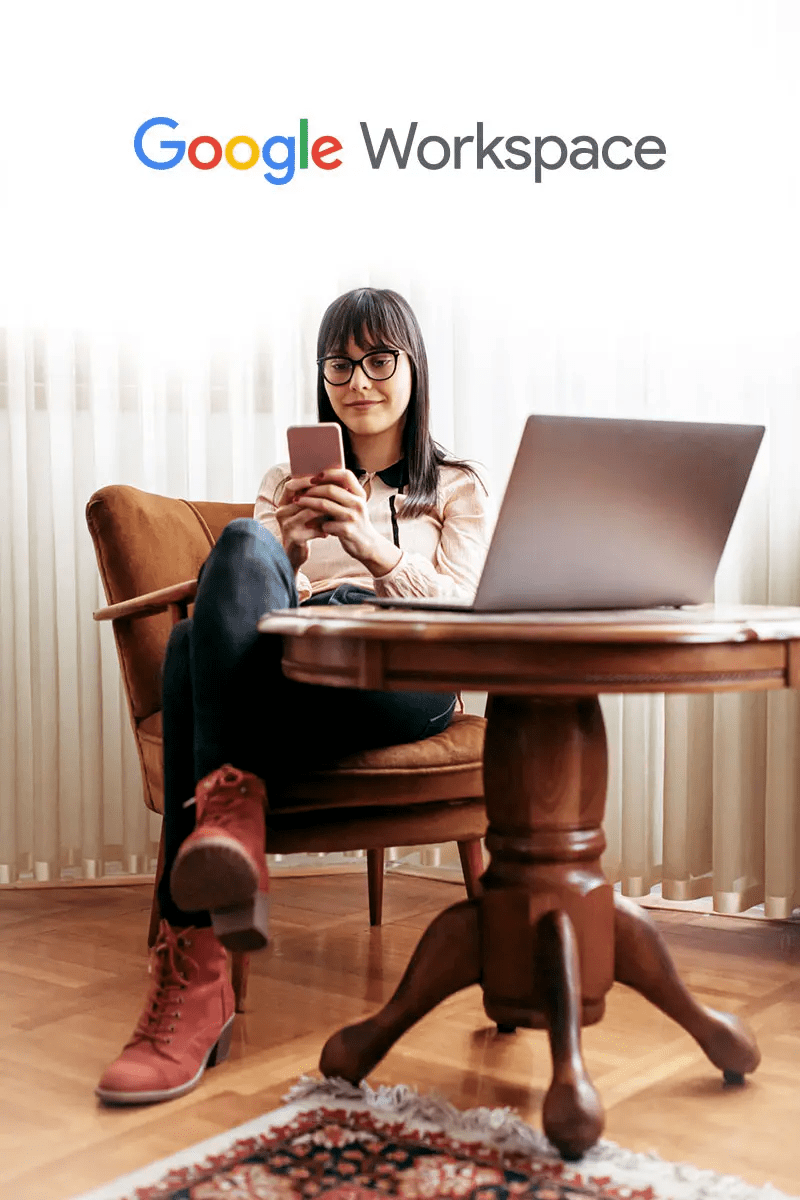 Woman smiling at phone with google logo behind her