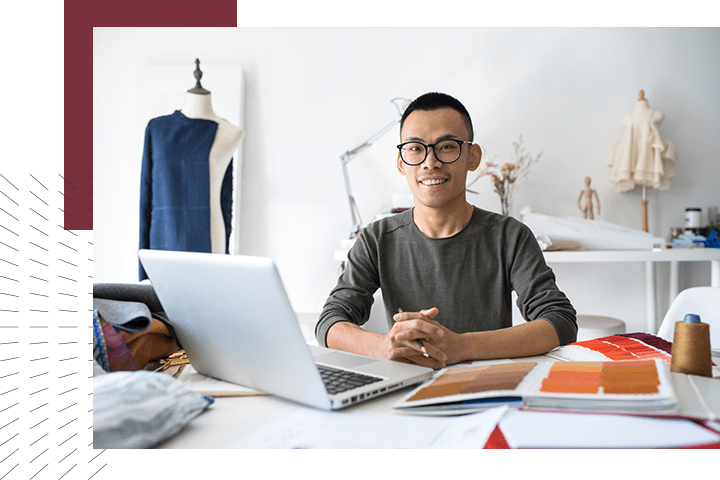 Man with computer smiling