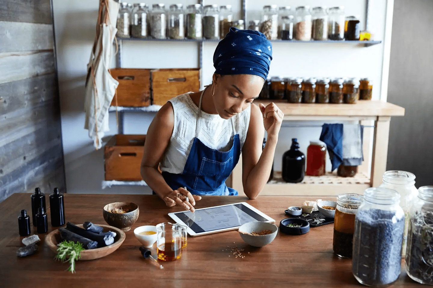 woman looking at her ipad thinking about building her perfect website