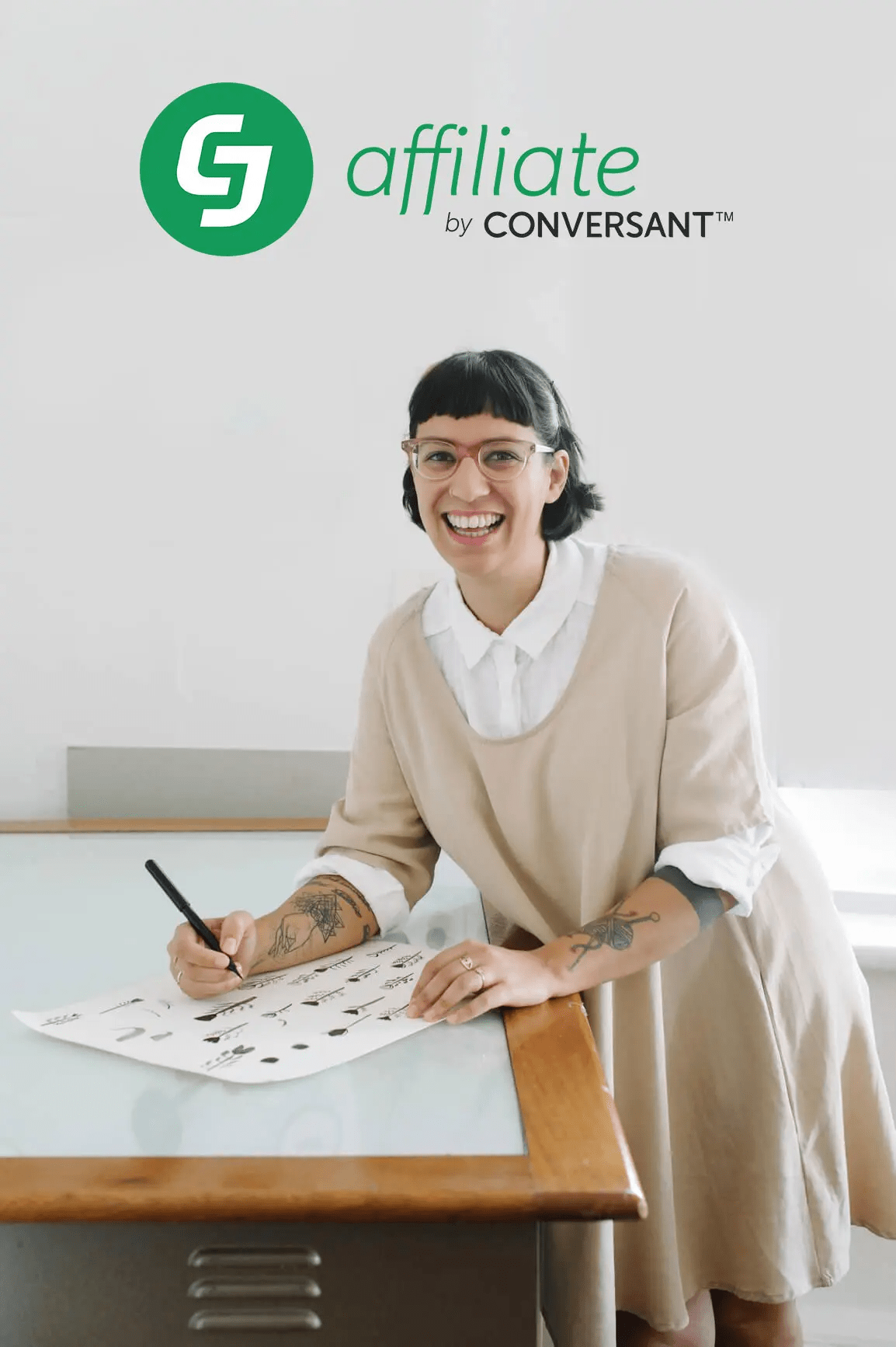 Woman drawing while smiling