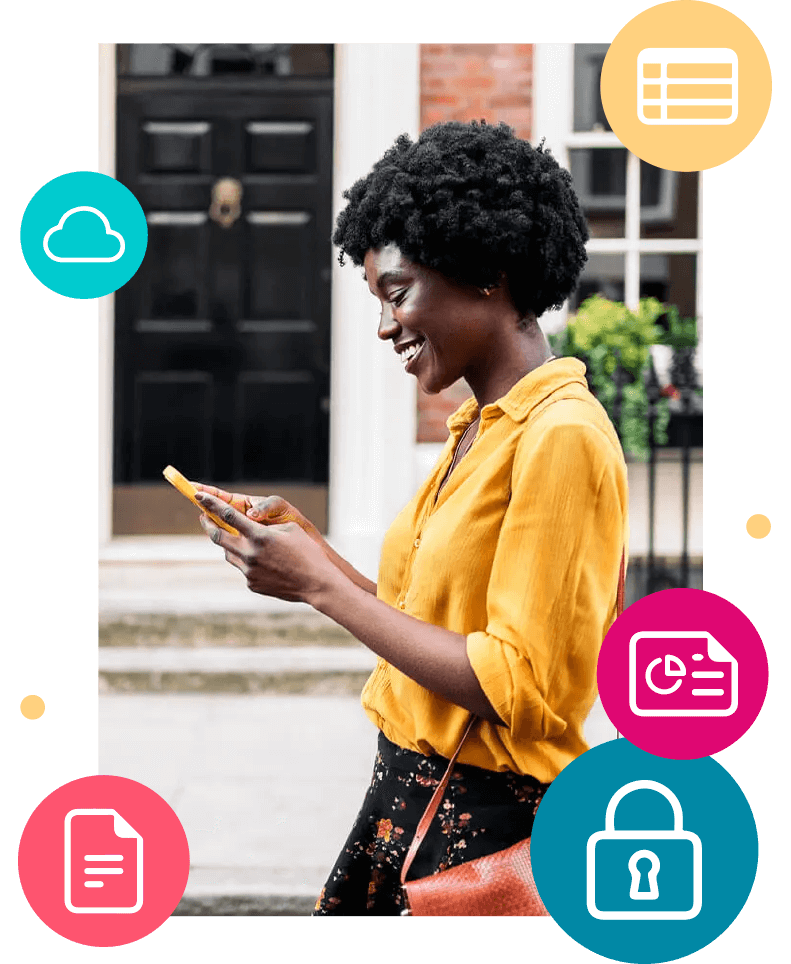 Woman smiling while looking at her phone walking