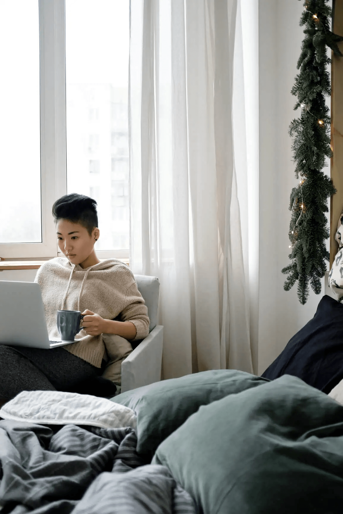 Woman sitting couch with laptop