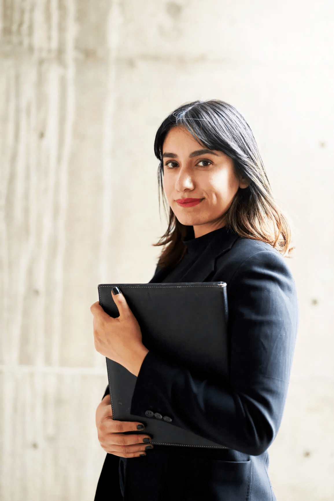 A person holding portfolio smiling