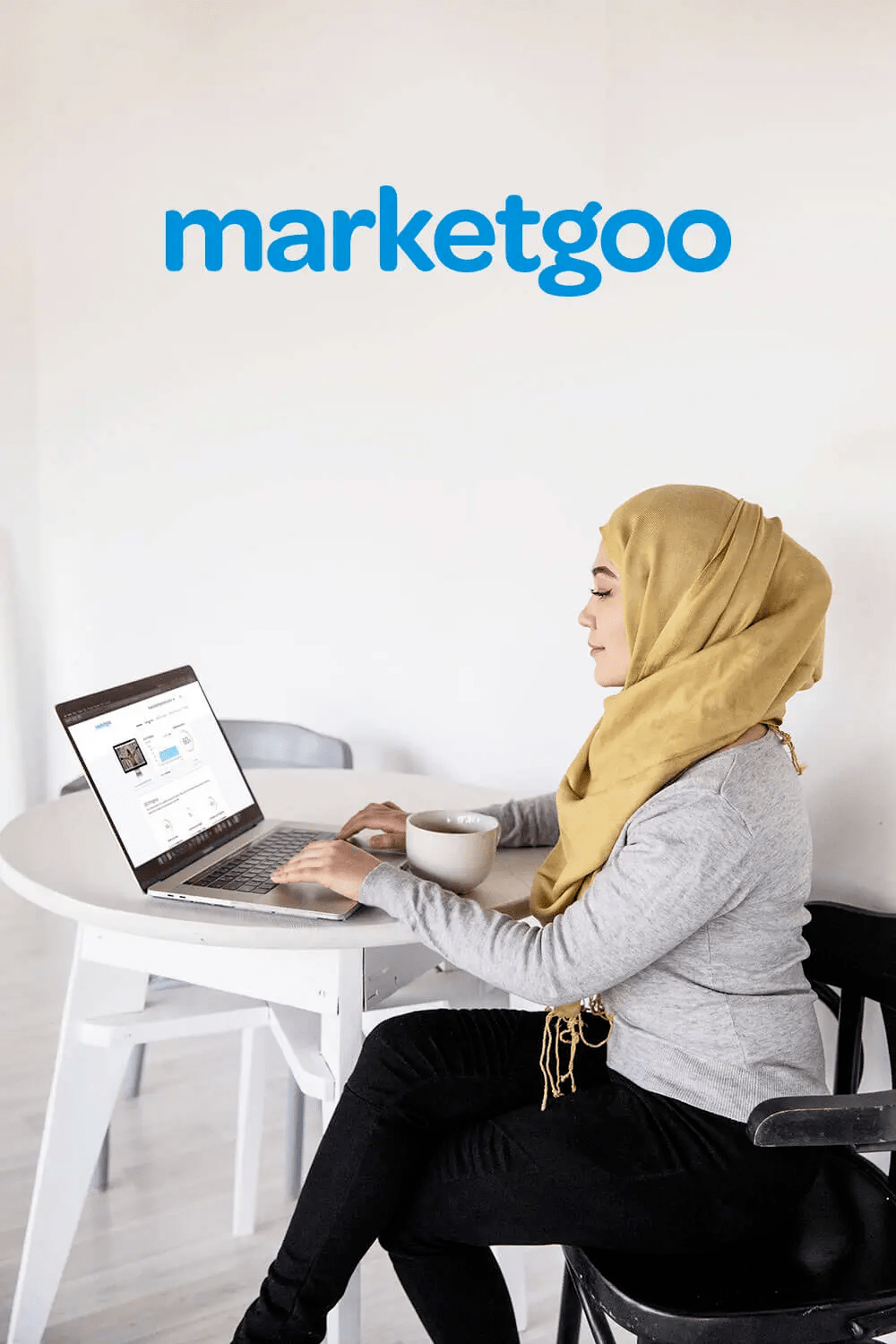 Woman using marketgoo on her laptop